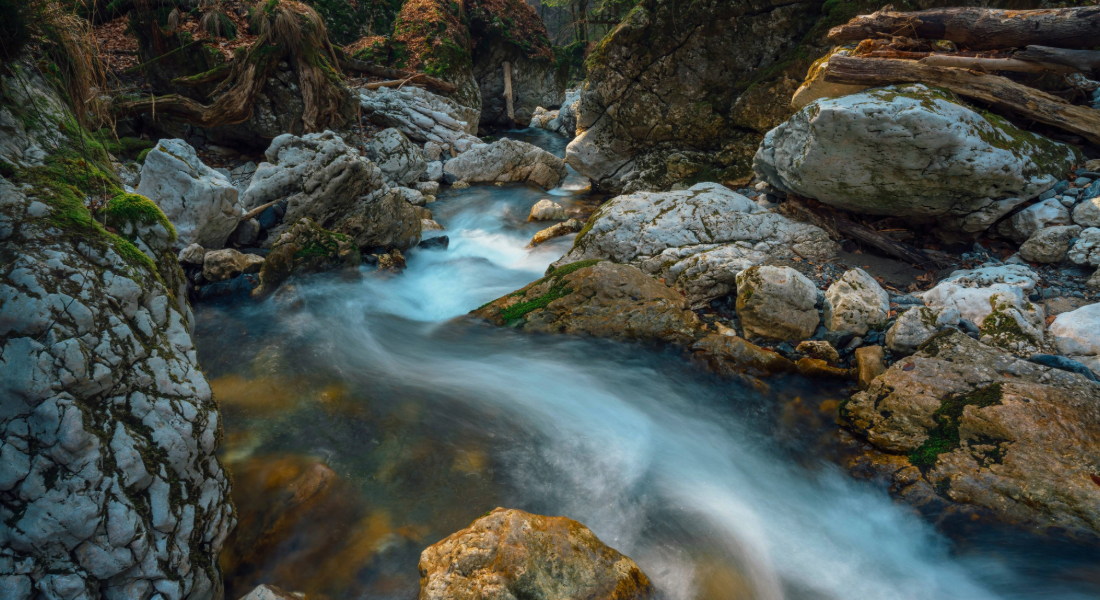 river running through a rocky bank